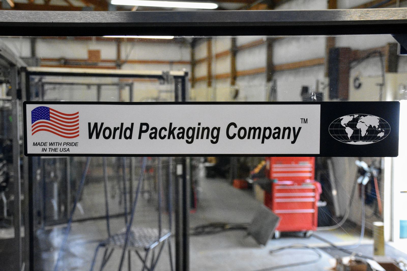 World Packaging Company nameplate reading Made with pride in the USA